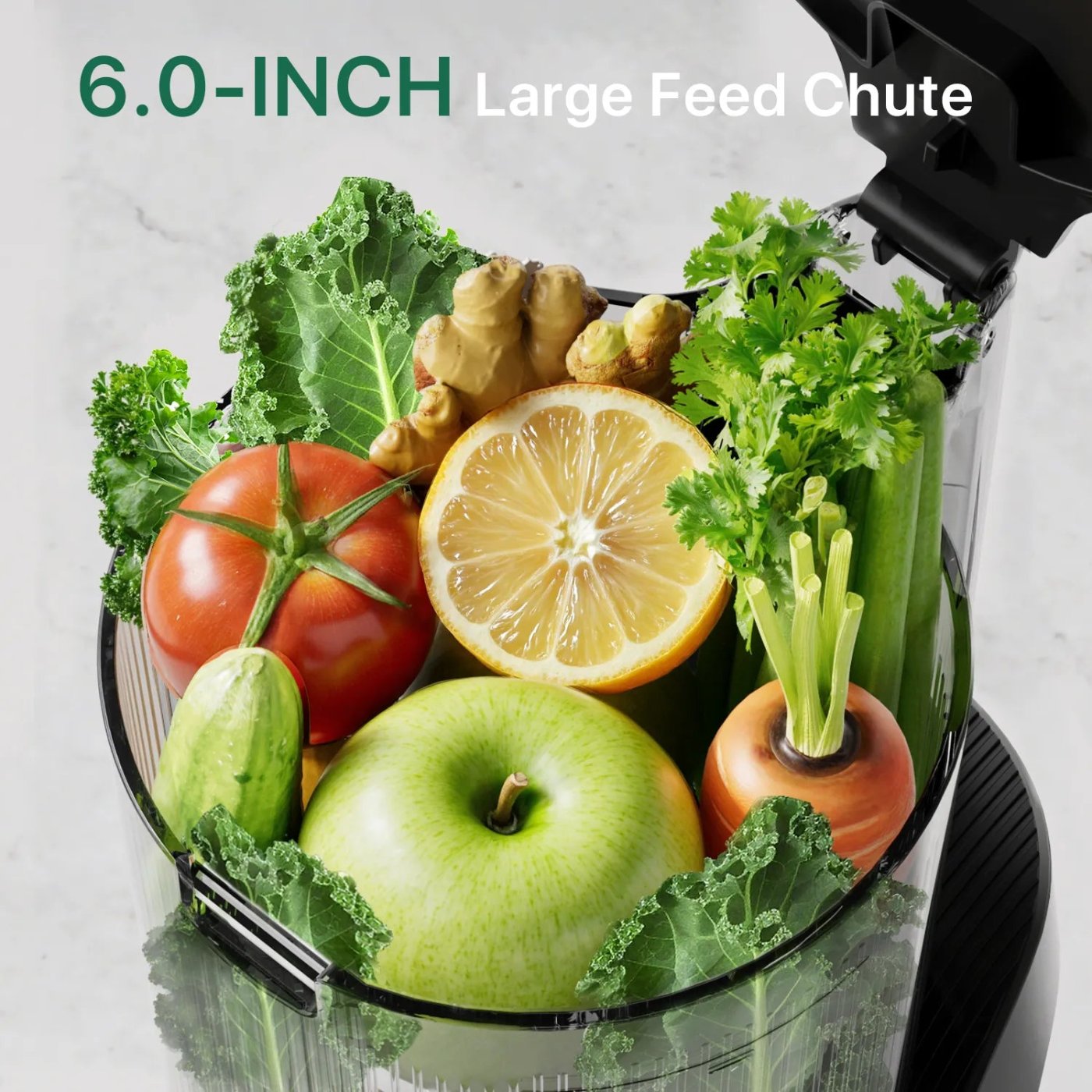 Close-up of the Canoly C16 6-inch wide feed chute filled with whole fruits and vegetables