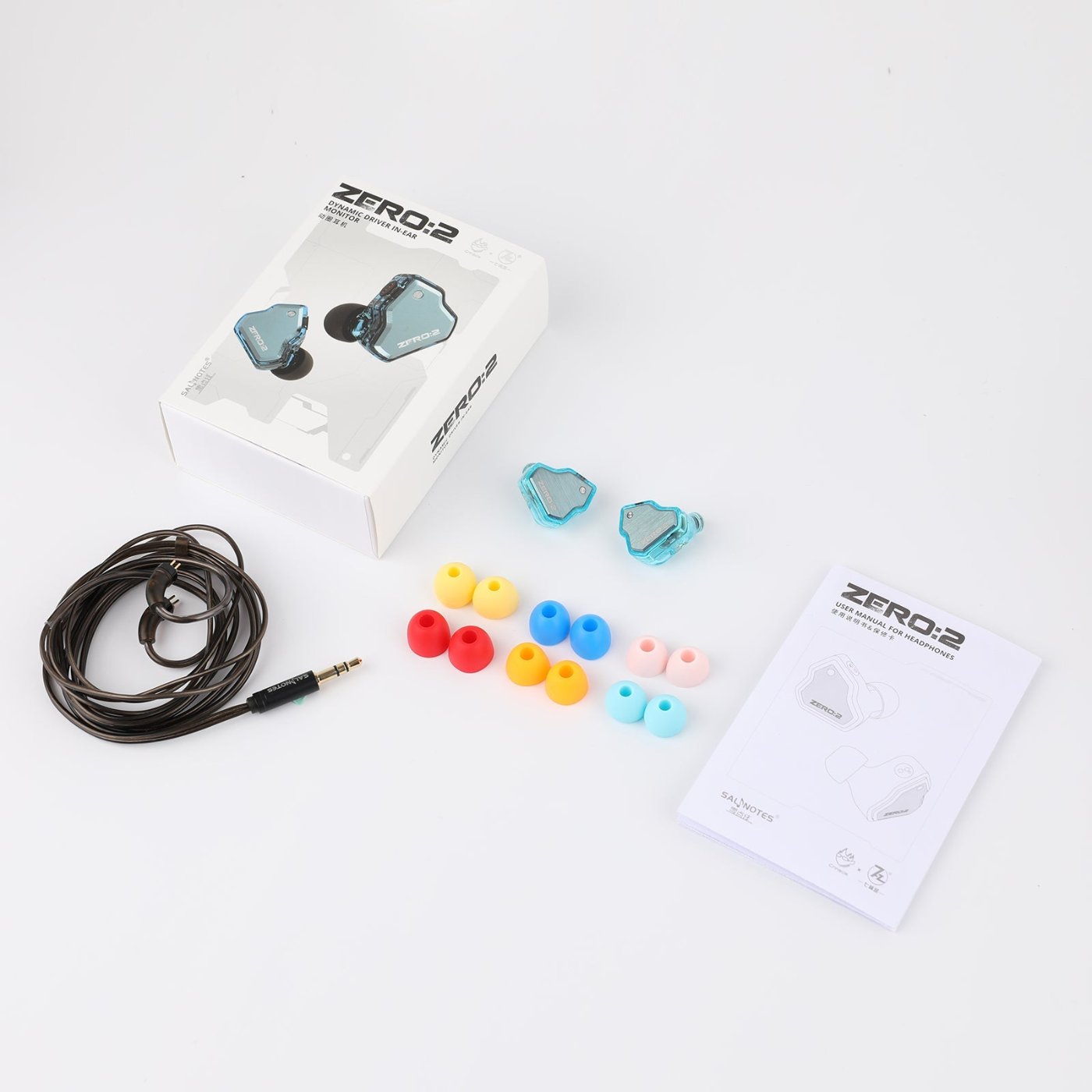 7HZ x Crinacle Zero:2 retail box, earpieces, cable, ear tips, and user manual laid out