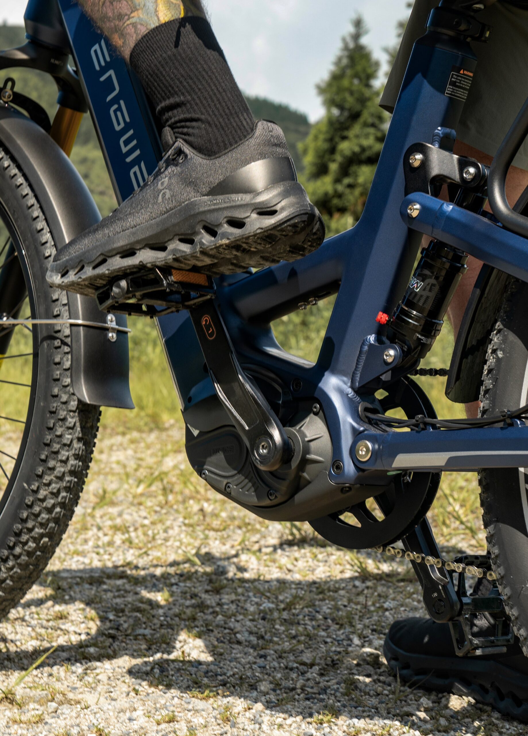 Close-up of the ENGWE E26 3.0 Pro mid-drive motor and rear suspension