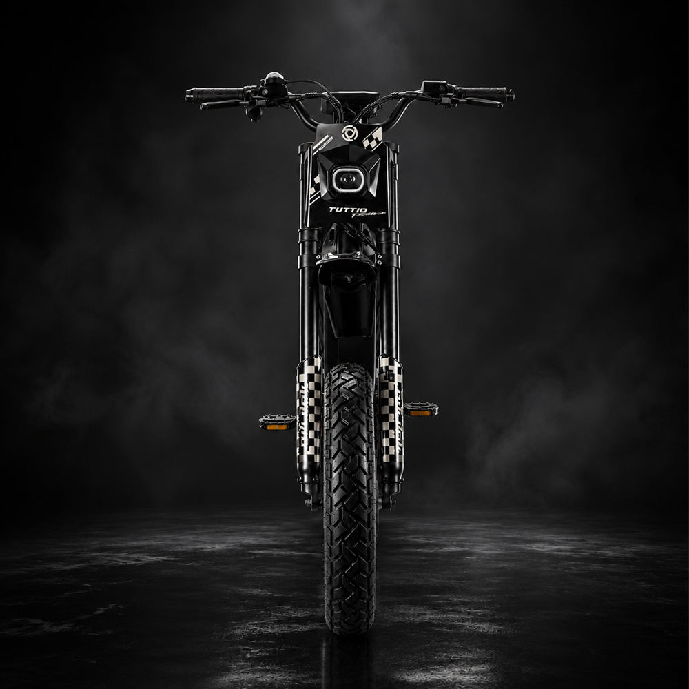Tuttio ICT 2.0 electric dirt bike front view showing the headlight, front suspension fork, and fat tire
